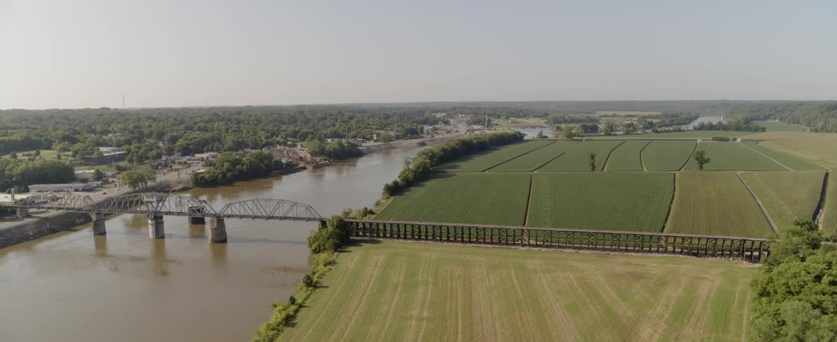 A bridge runs over a river in a remote area