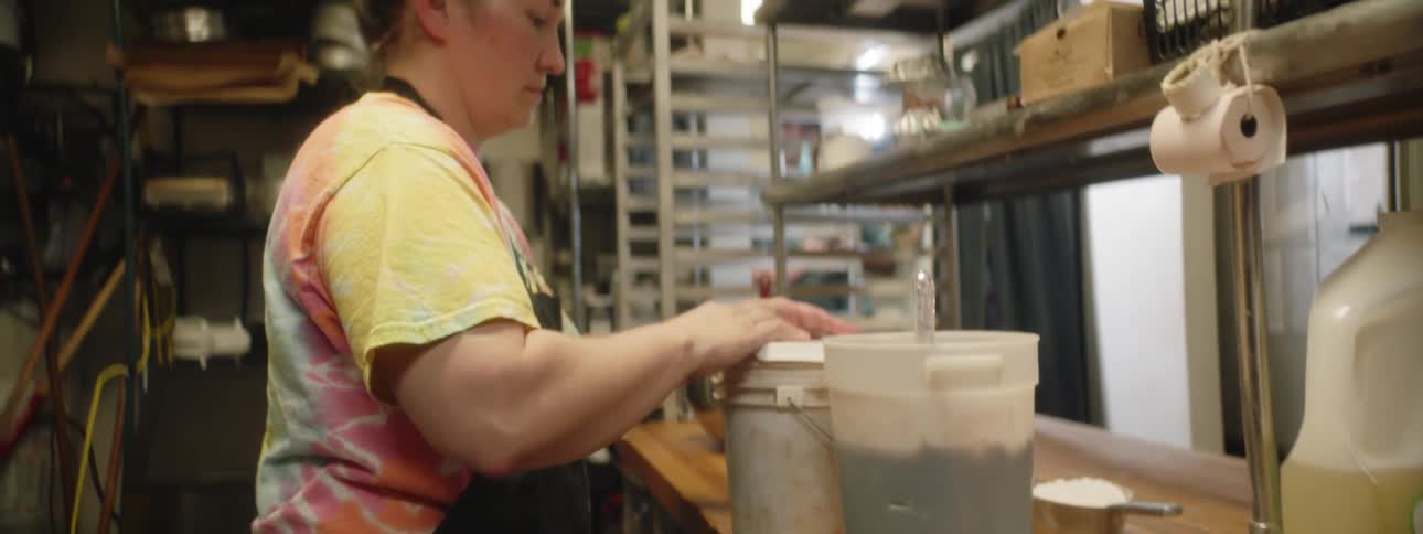 A woman is working in a kitchen