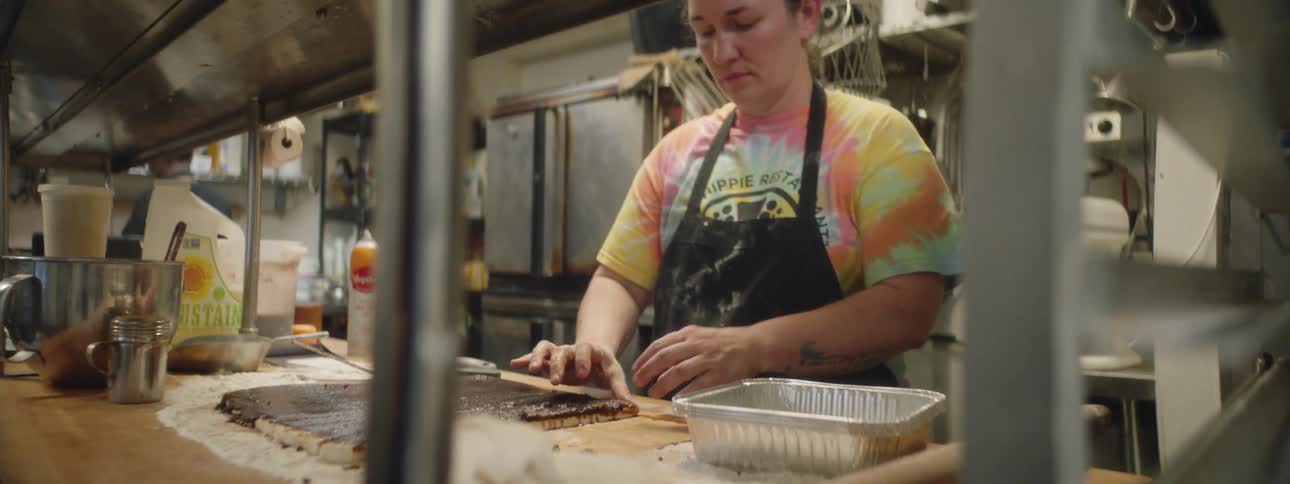 A woman cooks in a kitchen