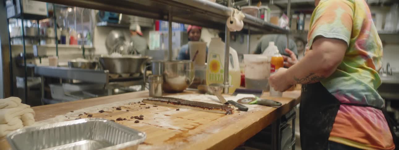 Woman prepares to bake cinnamon rolls