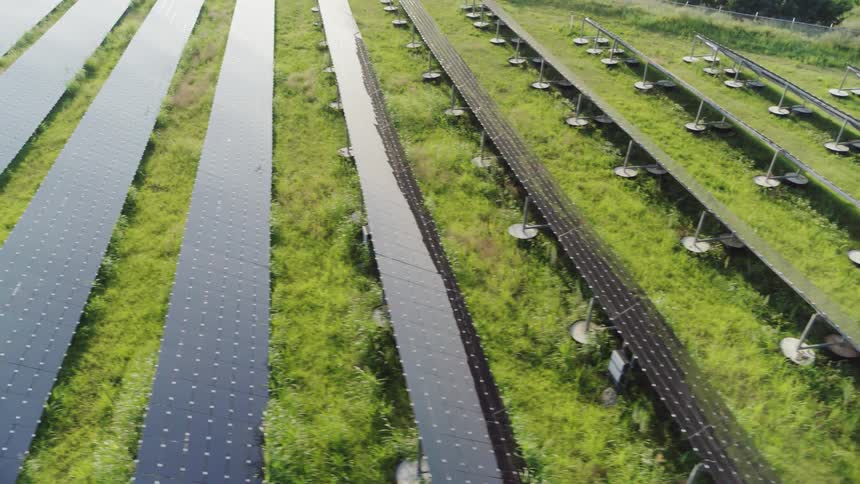 Aerial view of solar panels in a grass field