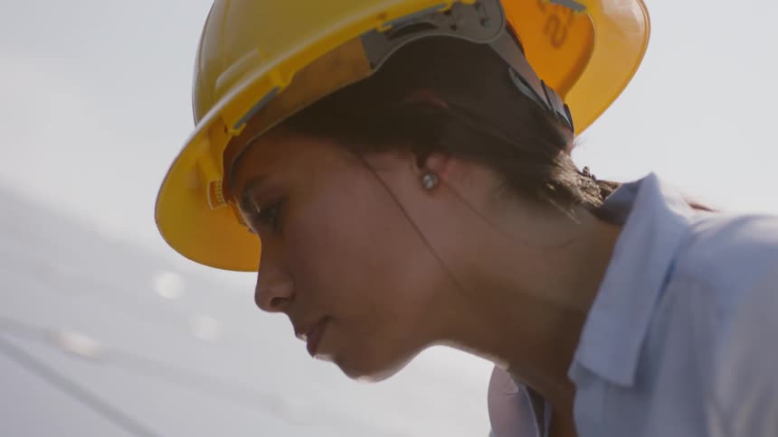 Woman looks over panel