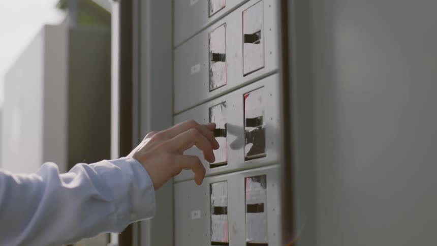 A person working on a row of servers