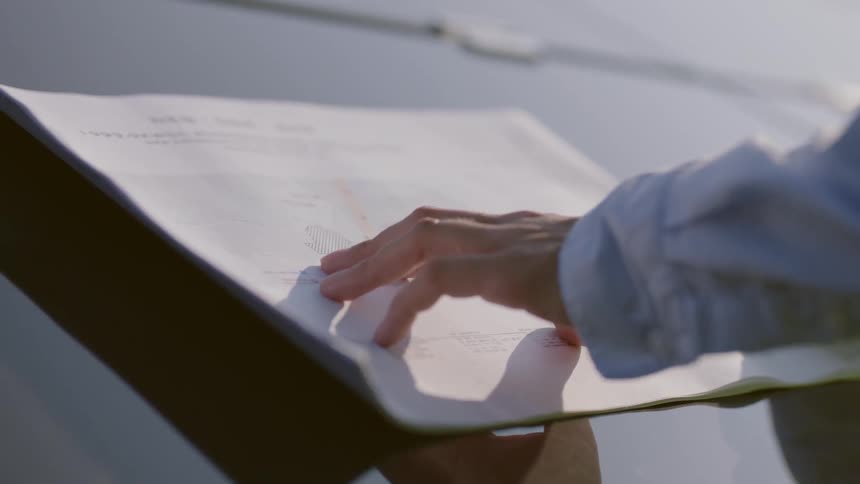 Woman reads plans