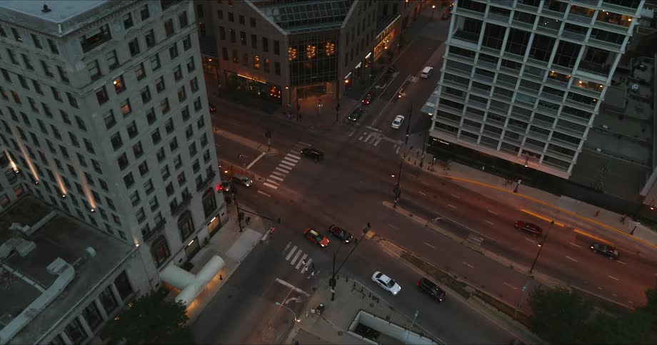 An aerial view of cars driving on a city street
