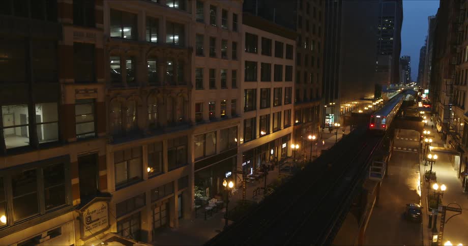 Train passes through city at night