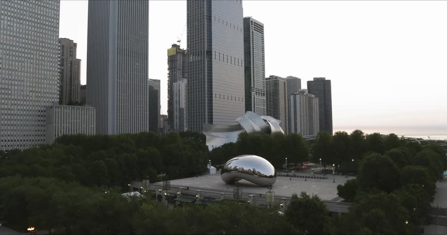 Chicago Bean sits in park near skyscrapers