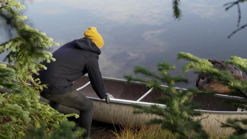 Man Canoeing On Foggy Lake