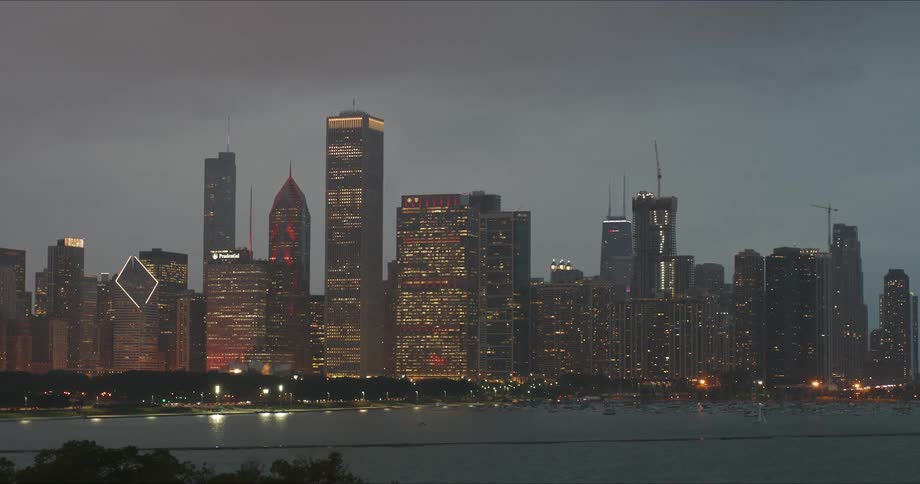 A city skyline over a bay at night
