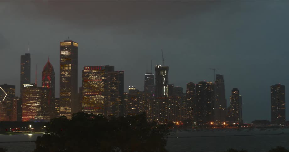 A city skyline across a body of water at night