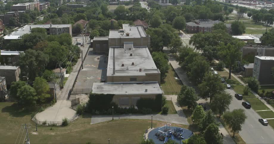 Aerial view of abandoned school in neighborhood