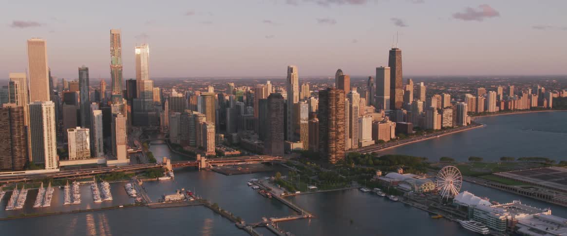 The camera flies by a large metro city