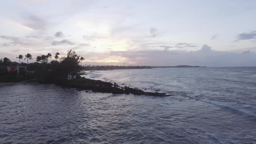 Sunset near a beach full of palm trees