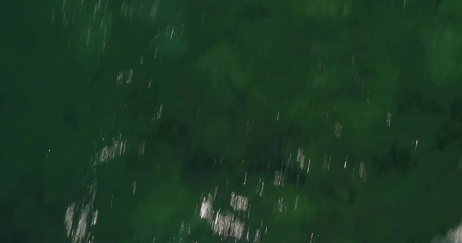 Passing over a body of water that is green