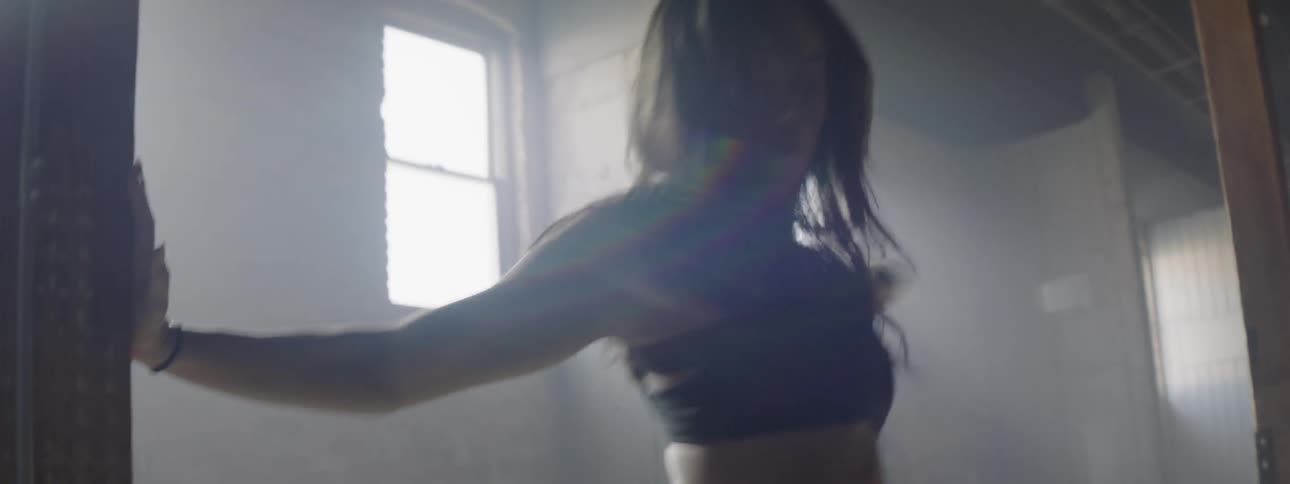 A woman dancing indoors