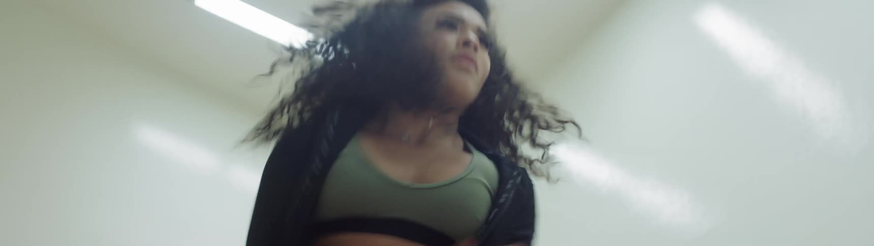 A woman is dancing indoors