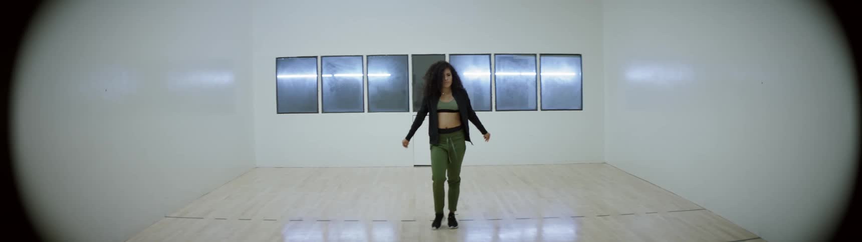 A woman is indoors stretching