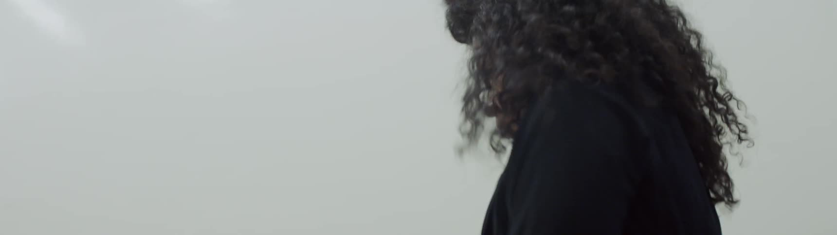 A woman is dancing indoors