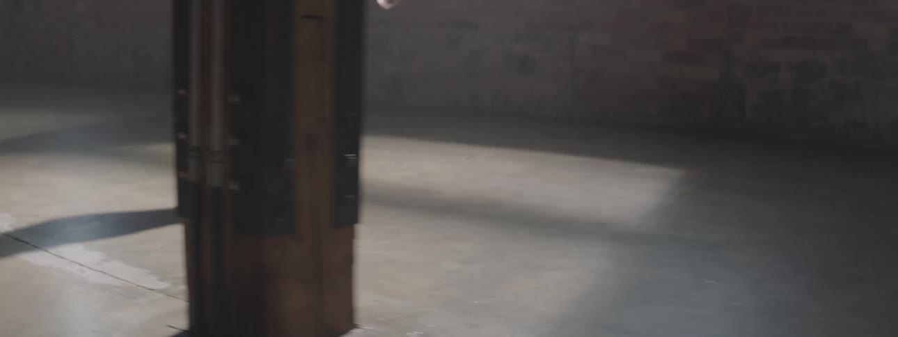 Woman walking through an old building