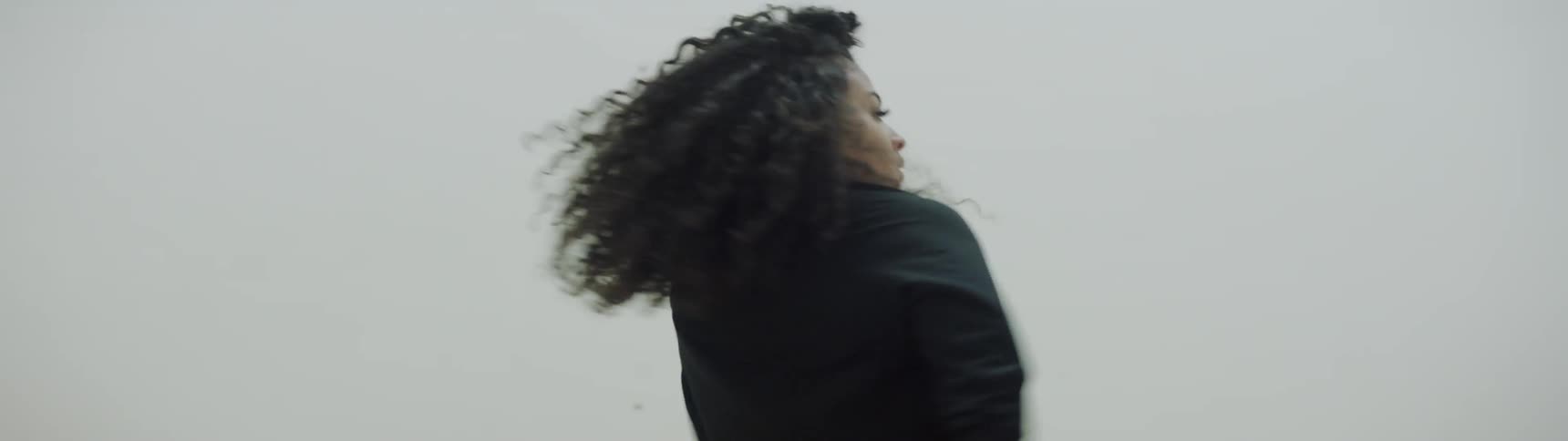 A young woman dances in a studio