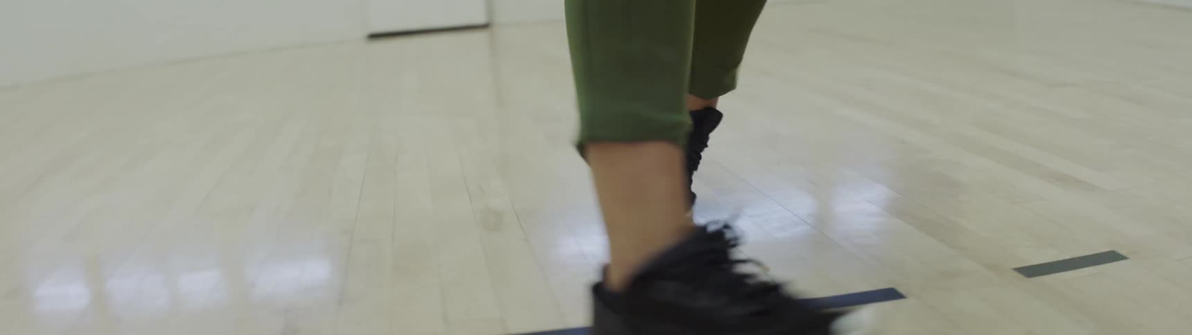 Woman performing dance moves on a dance studio