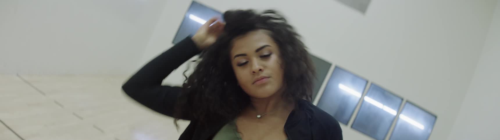 A woman stretches her neck