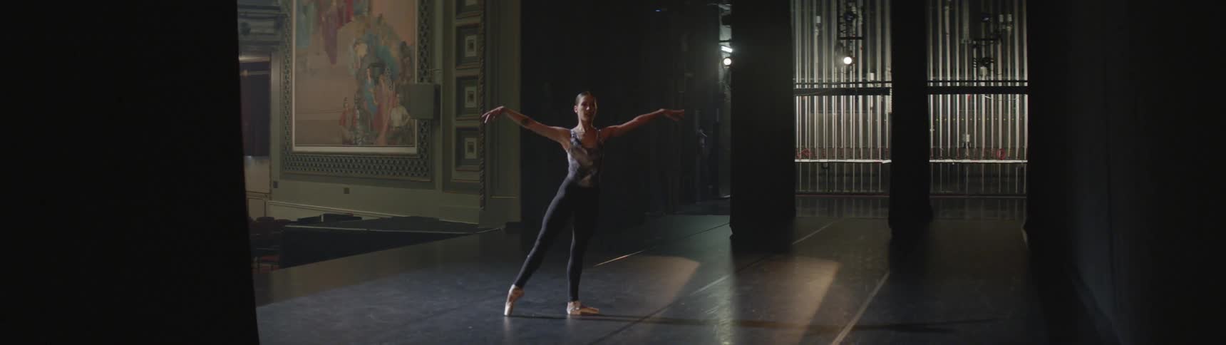 A woman is dancing indoors