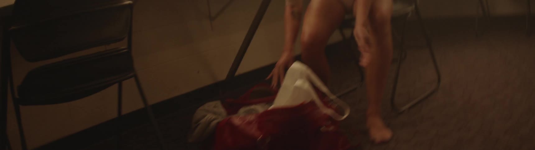 A ballerina pulls off her shoe and throws it in a bag before storming off