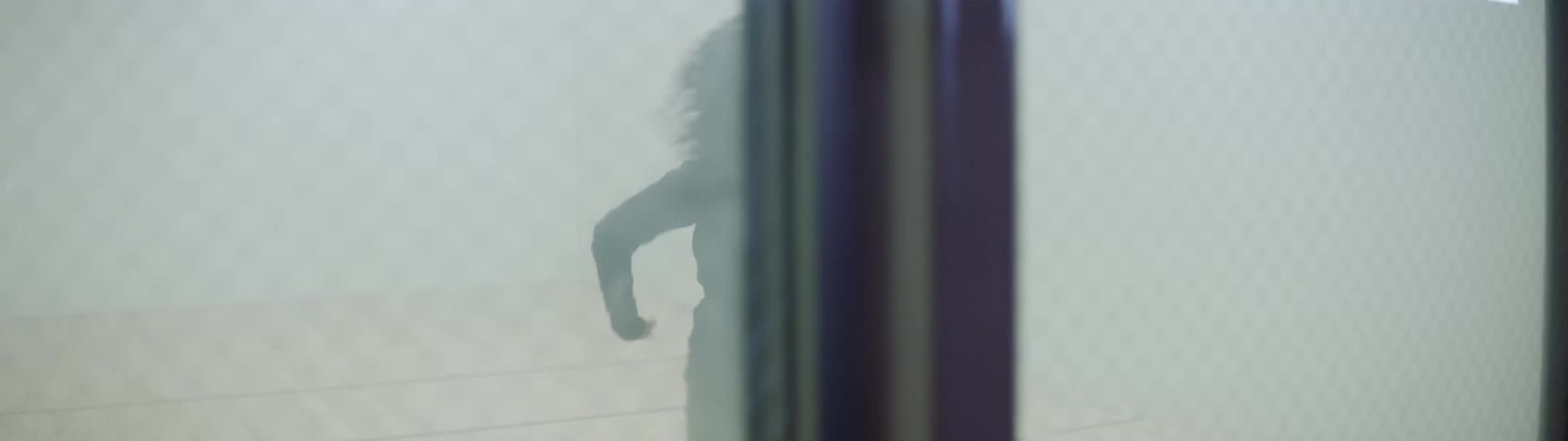 A woman is dancing indoors