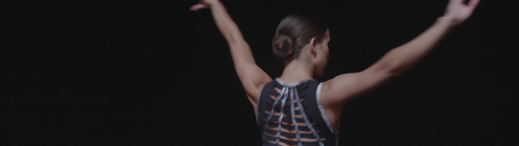 A ballerina dancing on a stage in a theater