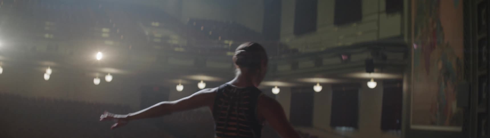 A ballerina performing in a theater