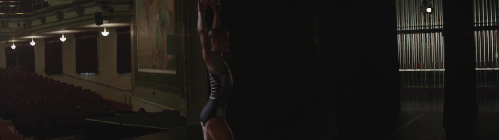 A woman is dancing on the stage