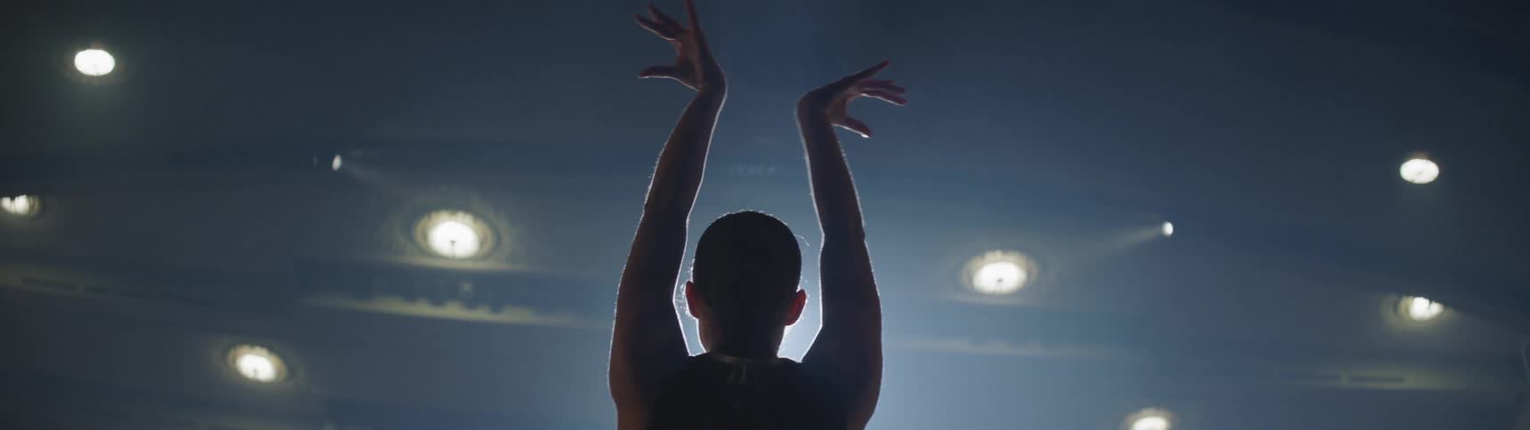 A person is dancing indoors