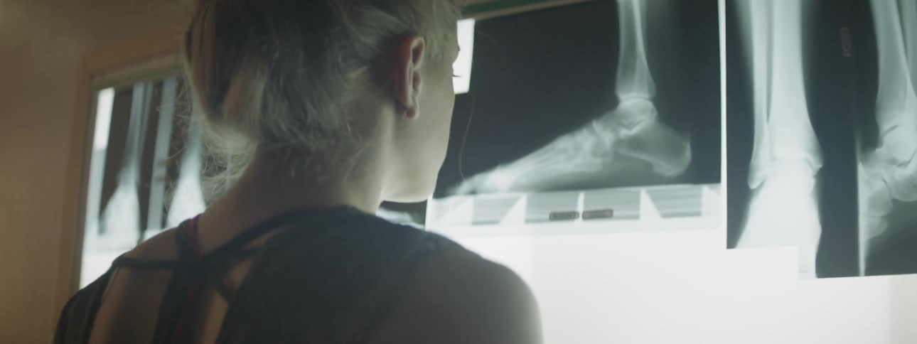 A young girl looks at x rays