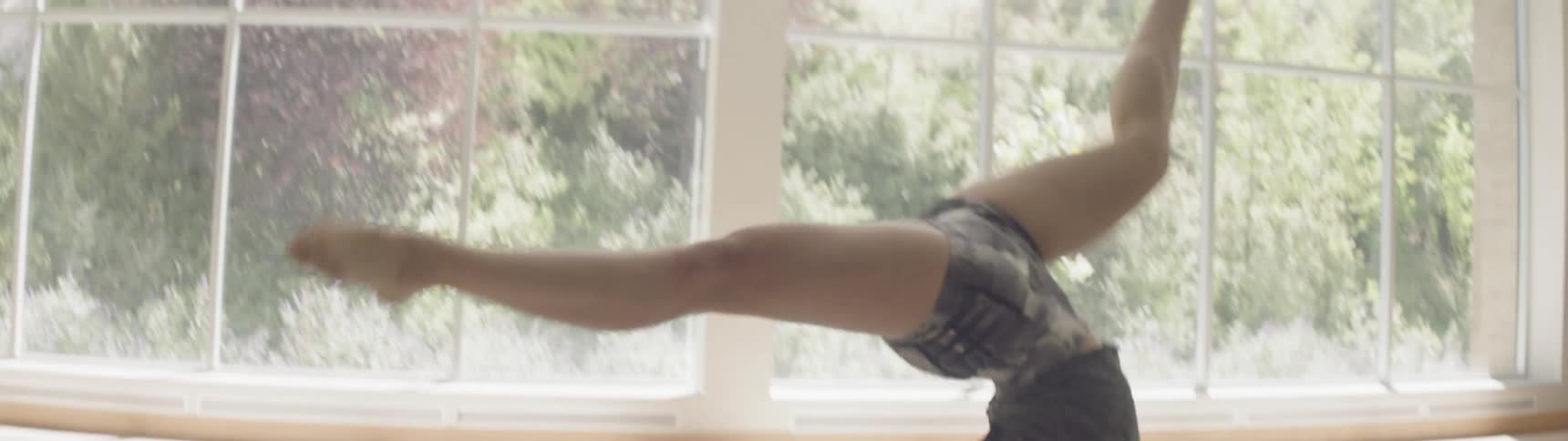 Woman practicing ballet at a dance studio