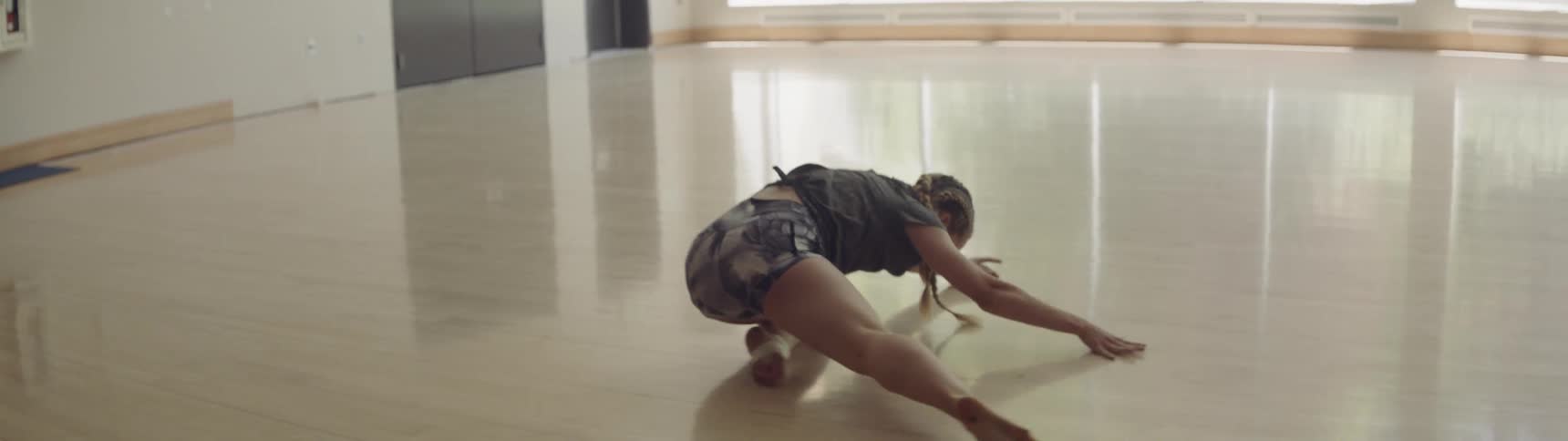 A young woman dances in a studio