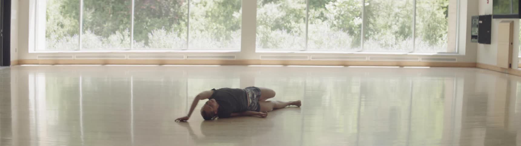 A woman is dancing indoors