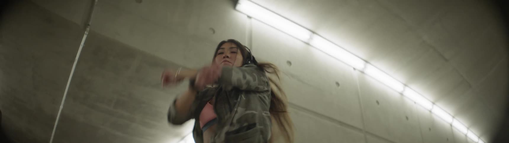 A young asian woman twirls