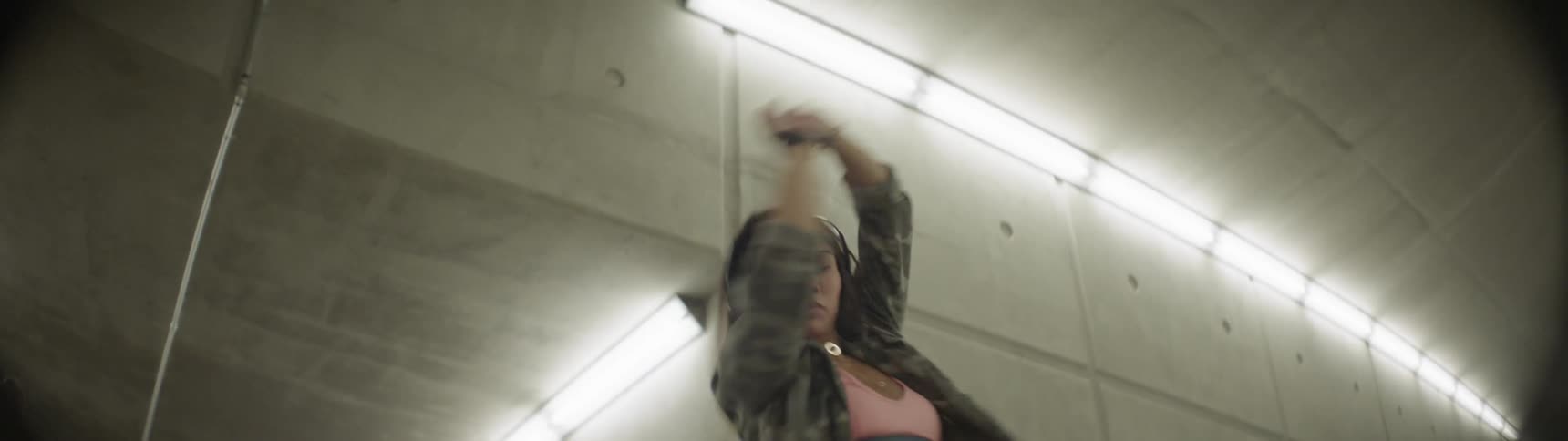 Dancer performing on the hallway of a subway station
