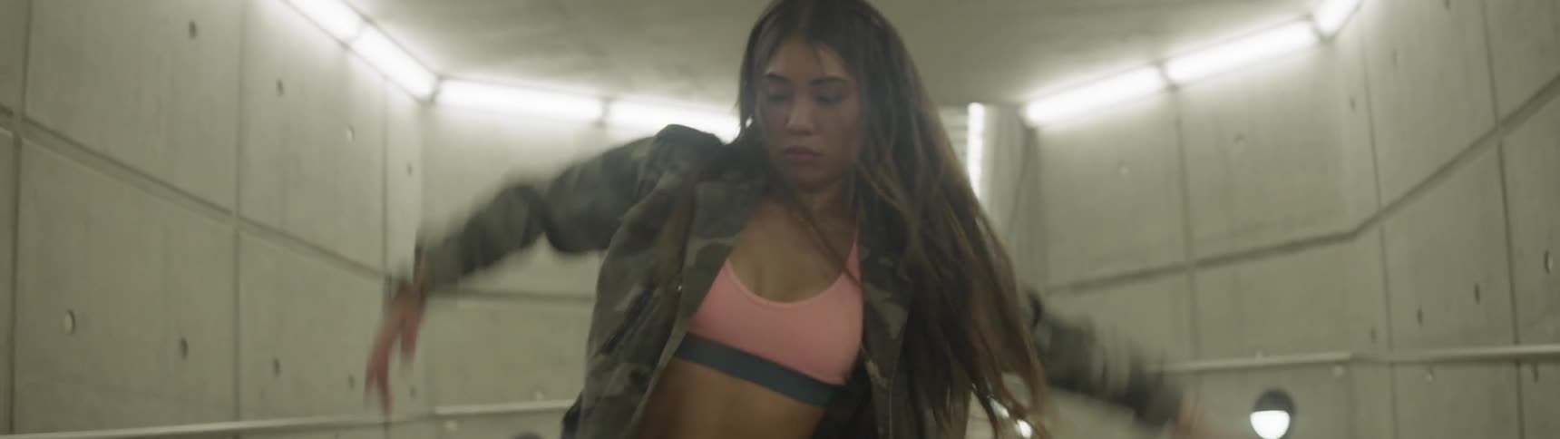 A woman is dancing indoors