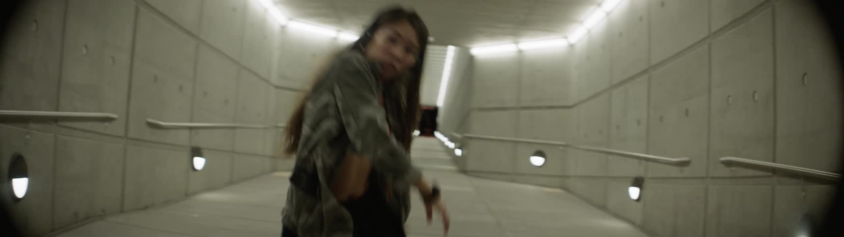 A woman is dancing indoors