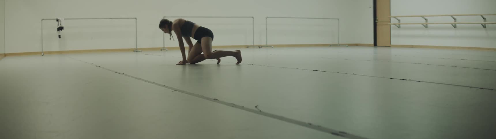 A young woman dances in a studio