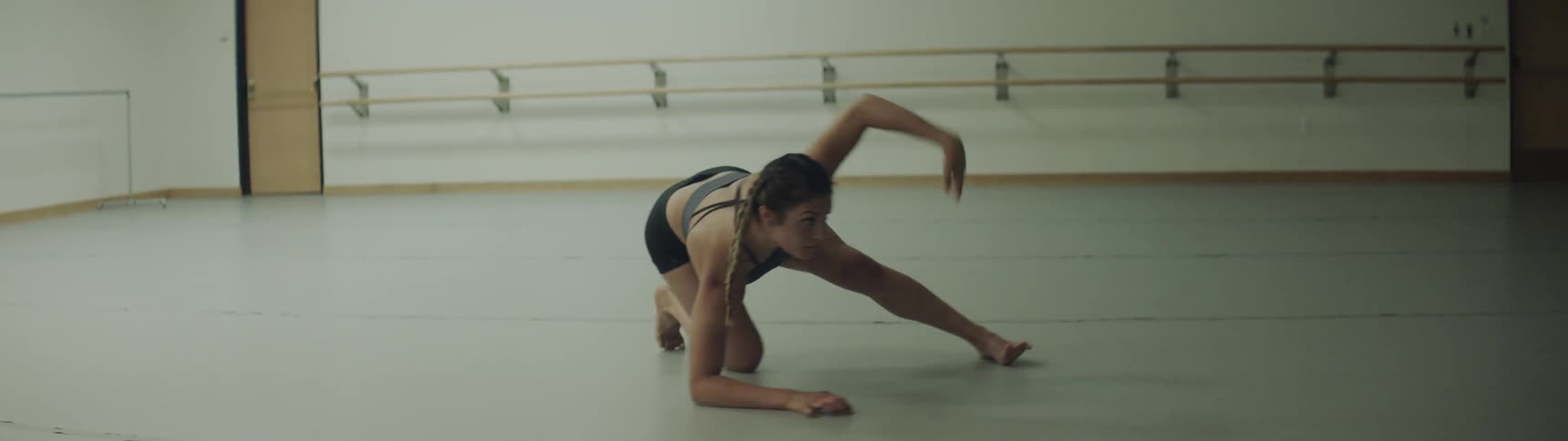 A woman is dancing indoors