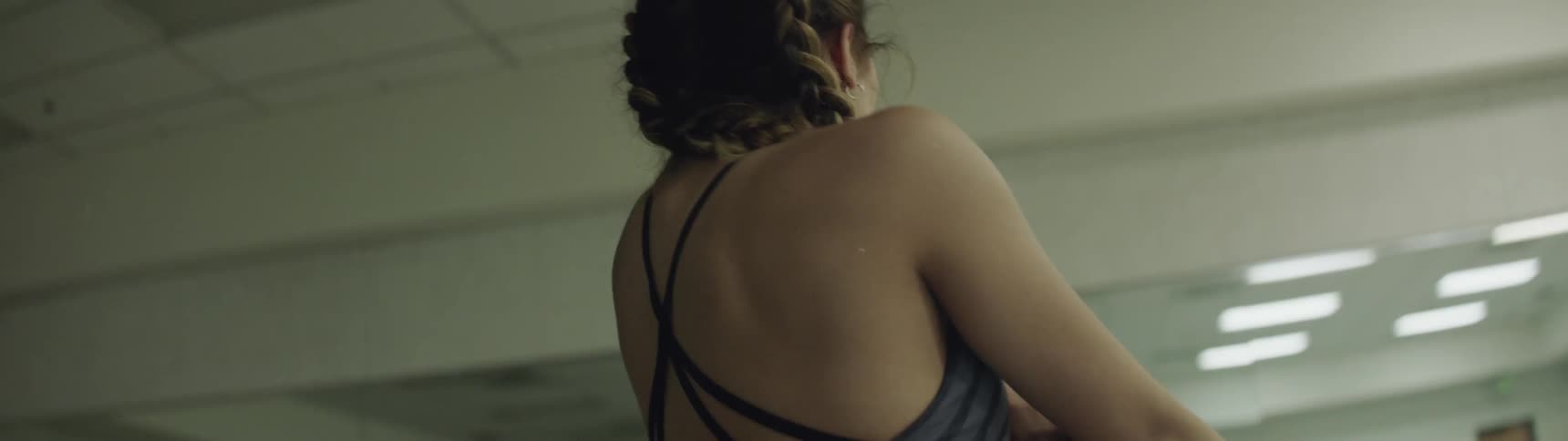 A woman is dancing indoors