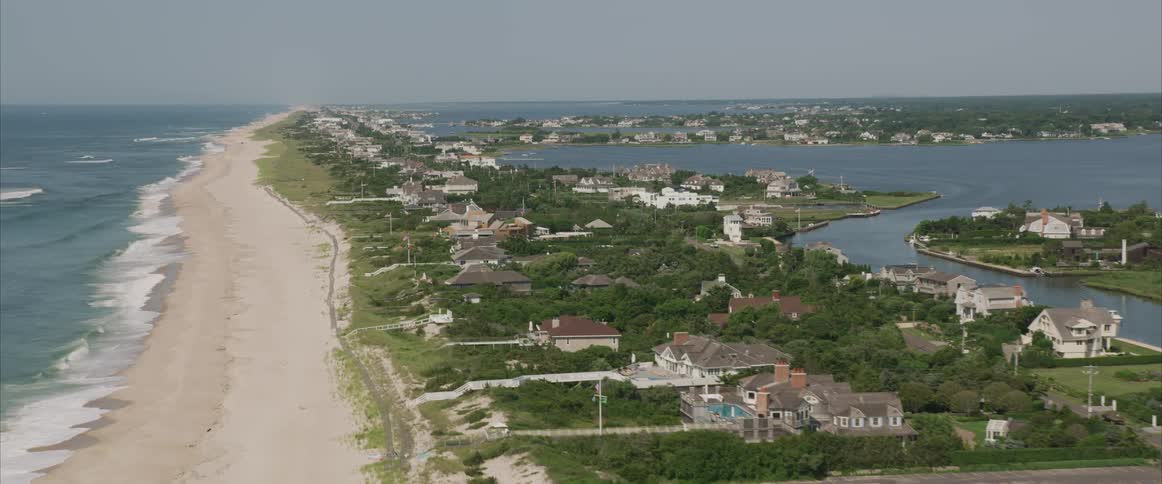Aerial shot of a neighborhood by a beach