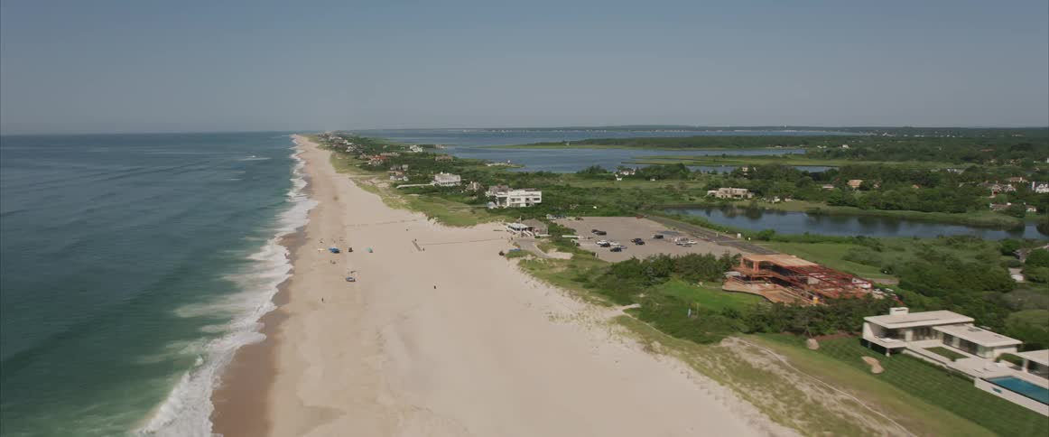 Mansions border beach and ocean