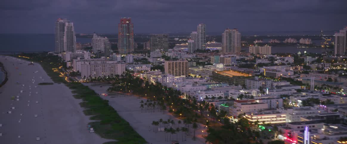The city is bright at dawn by the beach