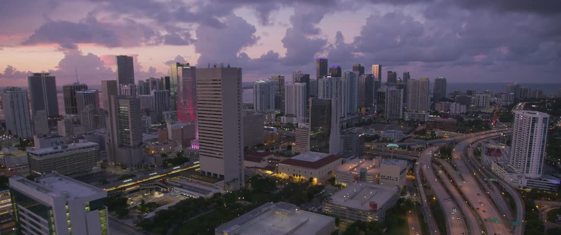 Cars travel through the city at dawn