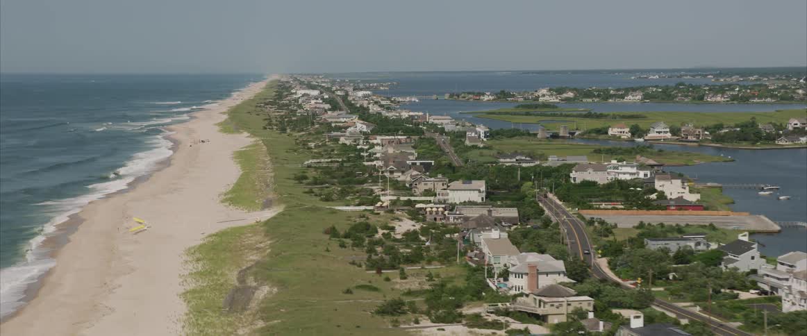 A row of beach houses on the sandy coast