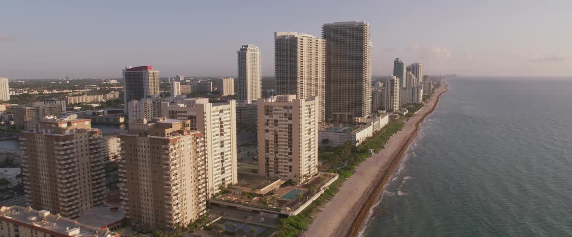 A city by the shore with buildings and the beach